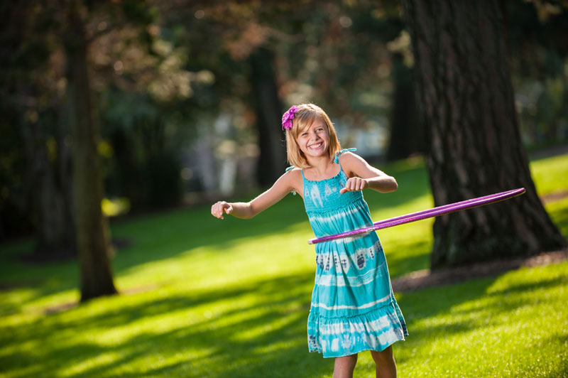little girl with a hula hoop