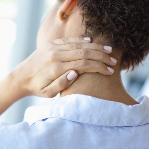 girl holding her neck