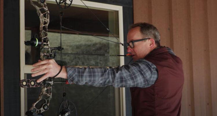 man holding bow