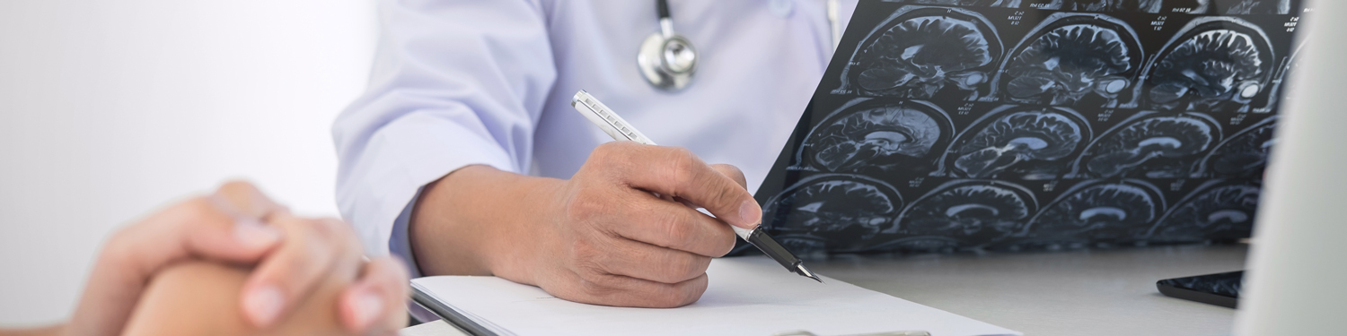doctor looking at brain scan