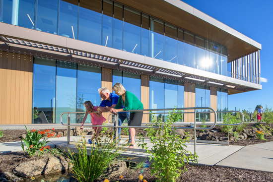 family outside the St. Charles Cancer Insistute